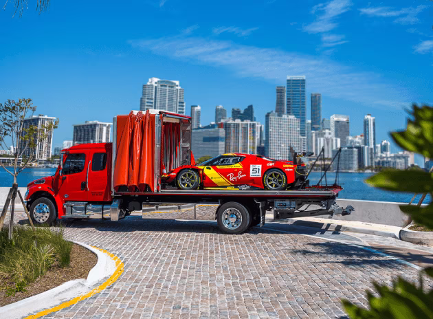 A Ferrari race car on a CARS vehicle transporter in Miami, USA.