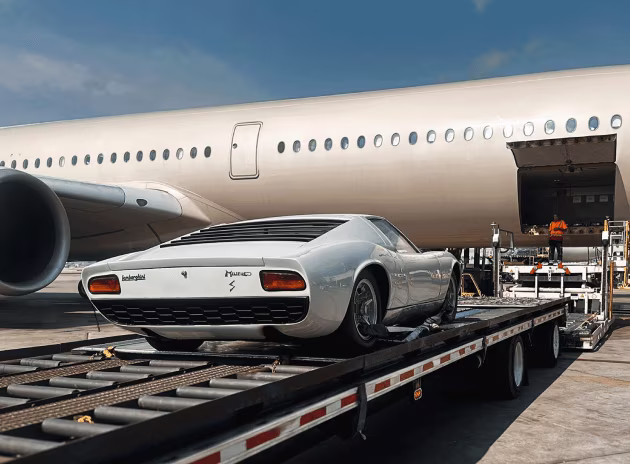 A Lamborghini Miura is prepared for air freight